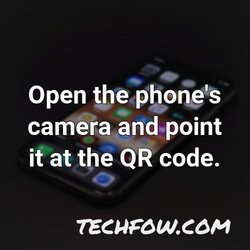 open the phone s camera and point it at the qr code