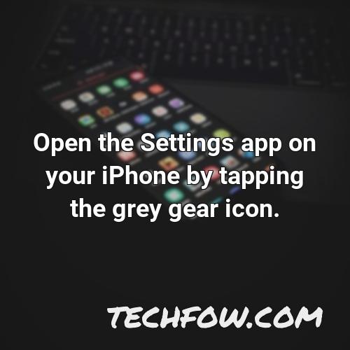 open the settings app on your iphone by tapping the grey gear icon