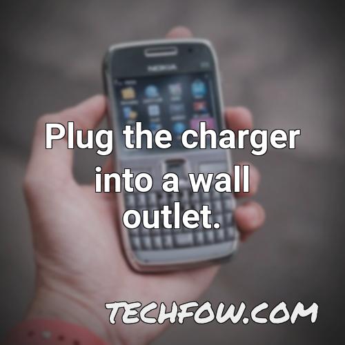 plug the charger into a wall outlet