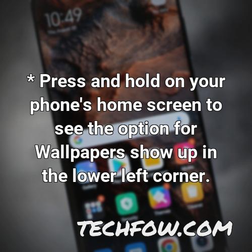 press and hold on your phone s home screen to see the option for wallpapers show up in the lower left corner