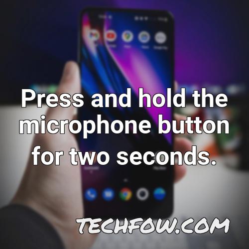 press and hold the microphone button for two seconds