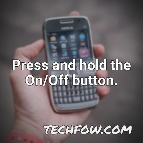 press and hold the on off button 1