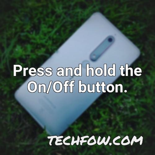 press and hold the on off button