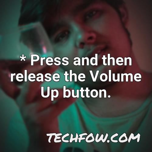 press and then release the volume up button