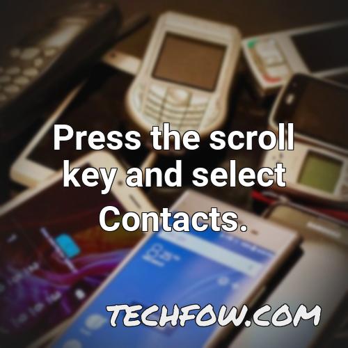 press the scroll key and select contacts