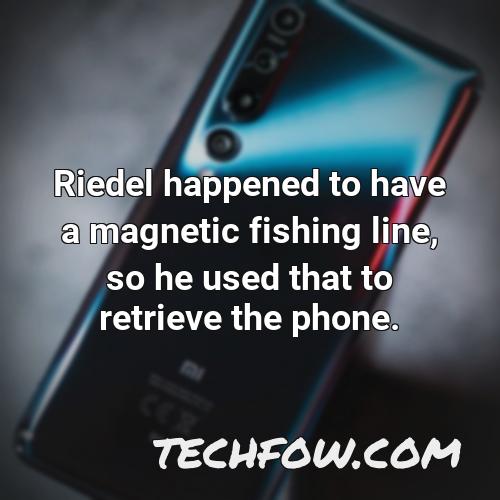 riedel happened to have a magnetic fishing line so he used that to retrieve the phone