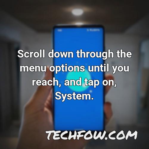 scroll down through the menu options until you reach and tap on system