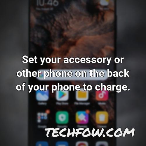 set your accessory or other phone on the back of your phone to charge 2