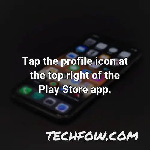 tap the profile icon at the top right of the play store app