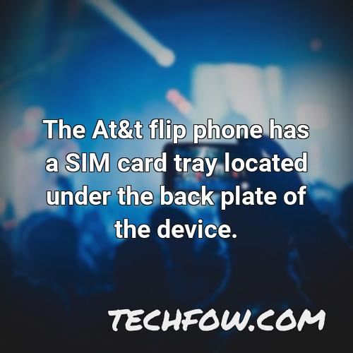 the at t flip phone has a sim card tray located under the back plate of the device