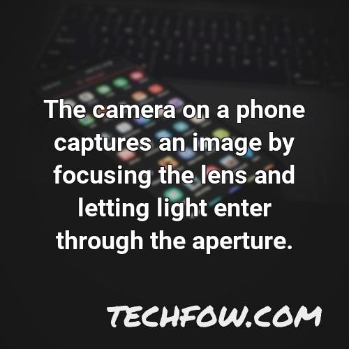 the camera on a phone captures an image by focusing the lens and letting light enter through the aperture