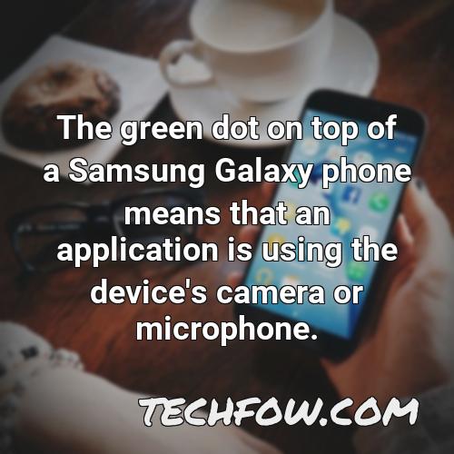the green dot on top of a samsung galaxy phone means that an application is using the device s camera or microphone