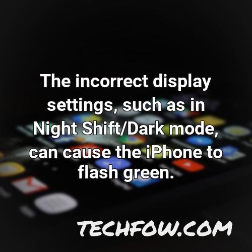 the incorrect display settings such as in night shift dark mode can cause the iphone to flash green