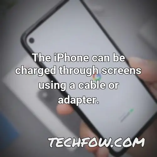 the iphone can be charged through screens using a cable or adapter