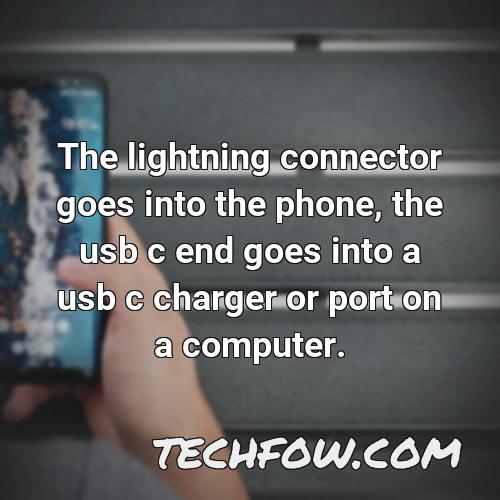 the lightning connector goes into the phone the usb c end goes into a usb c charger or port on a computer