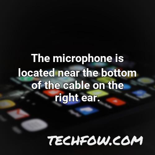 the microphone is located near the bottom of the cable on the right ear