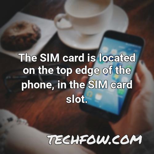 the sim card is located on the top edge of the phone in the sim card slot