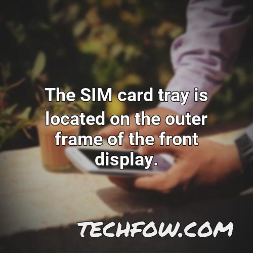 the sim card tray is located on the outer frame of the front display