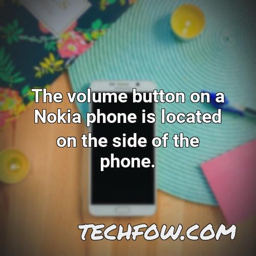 the volume button on a nokia phone is located on the side of the phone