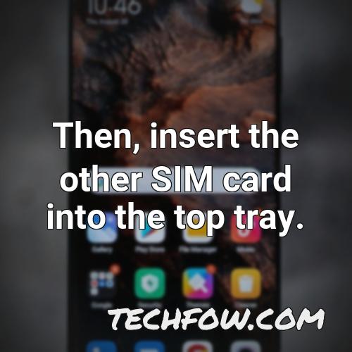 then insert the other sim card into the top tray 1