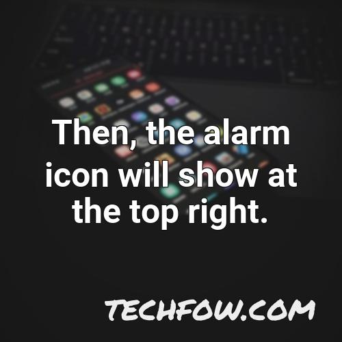 then the alarm icon will show at the top right