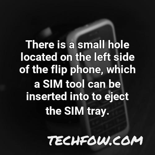 there is a small hole located on the left side of the flip phone which a sim tool can be inserted into to eject the sim tray