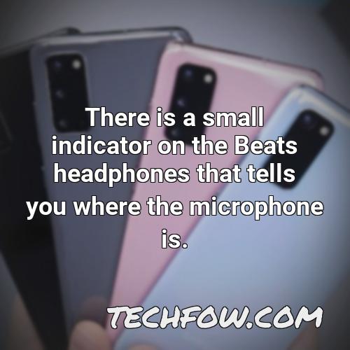 there is a small indicator on the beats headphones that tells you where the microphone is