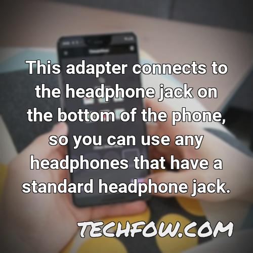 this adapter connects to the headphone jack on the bottom of the phone so you can use any headphones that have a standard headphone jack