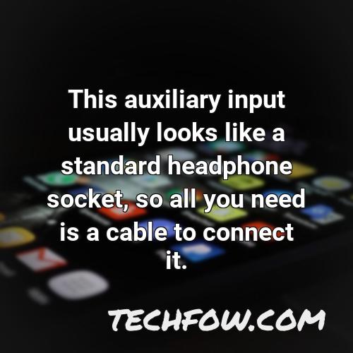 this auxiliary input usually looks like a standard headphone socket so all you need is a cable to connect it