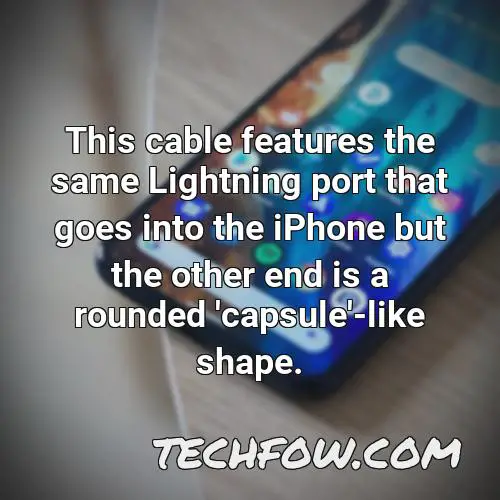 this cable features the same lightning port that goes into the iphone but the other end is a rounded capsule like shape 2