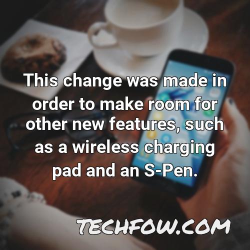 this change was made in order to make room for other new features such as a wireless charging pad and an s pen