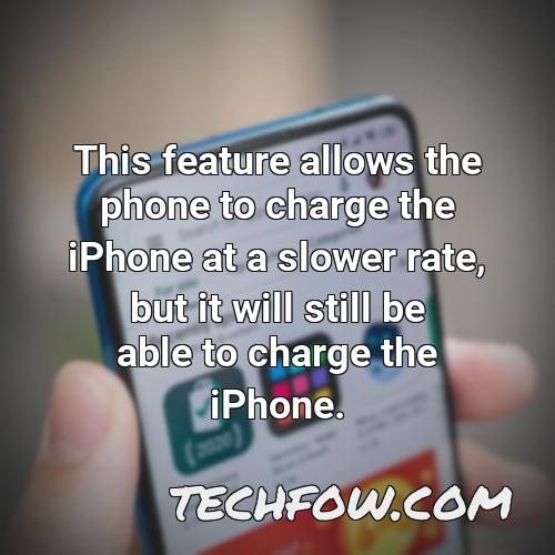this feature allows the phone to charge the iphone at a slower rate but it will still be able to charge the iphone