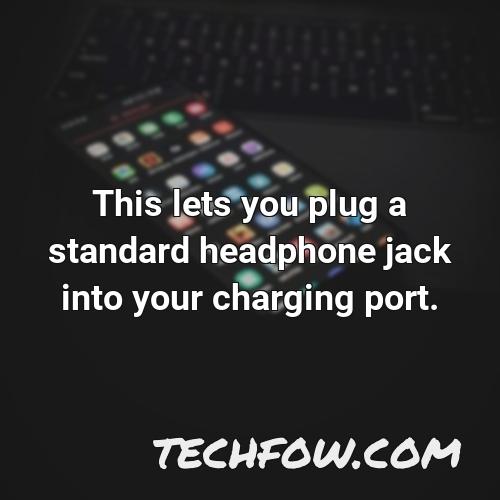 this lets you plug a standard headphone jack into your charging port 1