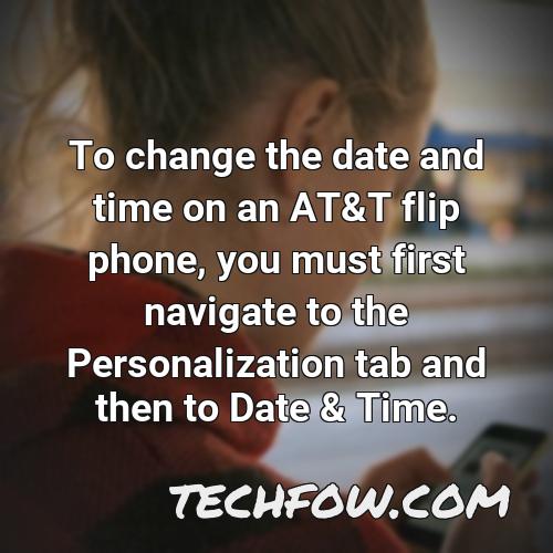 to change the date and time on an at t flip phone you must first navigate to the personalization tab and then to date time