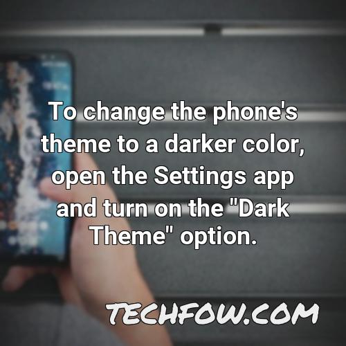 to change the phone s theme to a darker color open the settings app and turn on the dark theme option