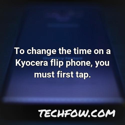 to change the time on a kyocera flip phone you must first tap