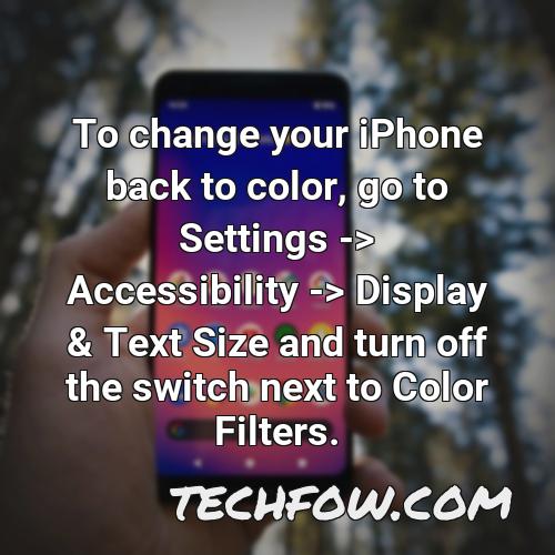 to change your iphone back to color go to settings accessibility display text size and turn off the switch next to color filters