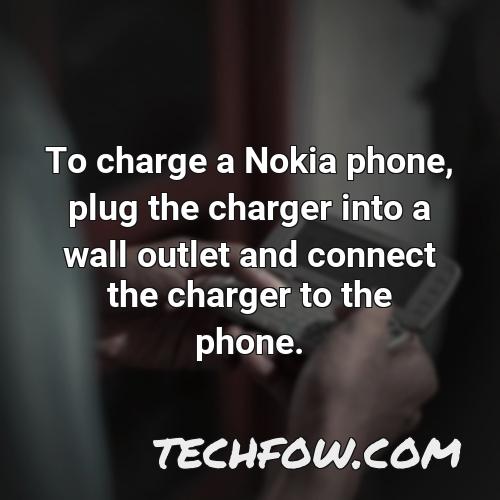 to charge a nokia phone plug the charger into a wall outlet and connect the charger to the phone