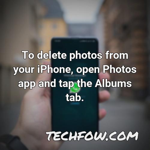 to delete photos from your iphone open photos app and tap the albums tab