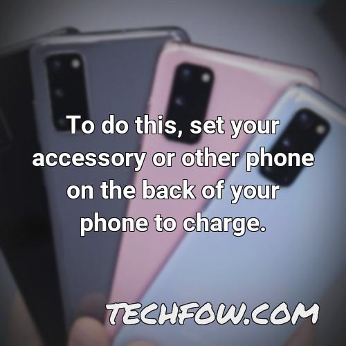 to do this set your accessory or other phone on the back of your phone to charge