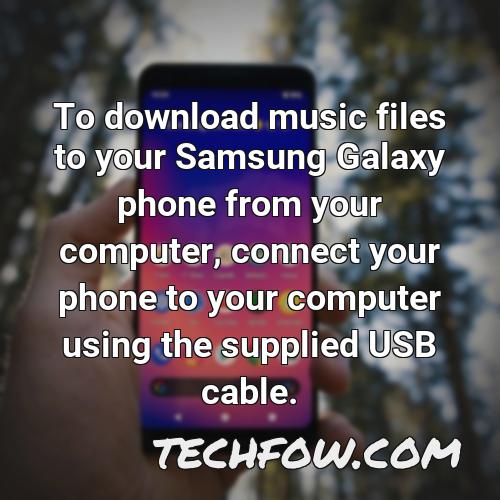 to download music files to your samsung galaxy phone from your computer connect your phone to your computer using the supplied usb cable