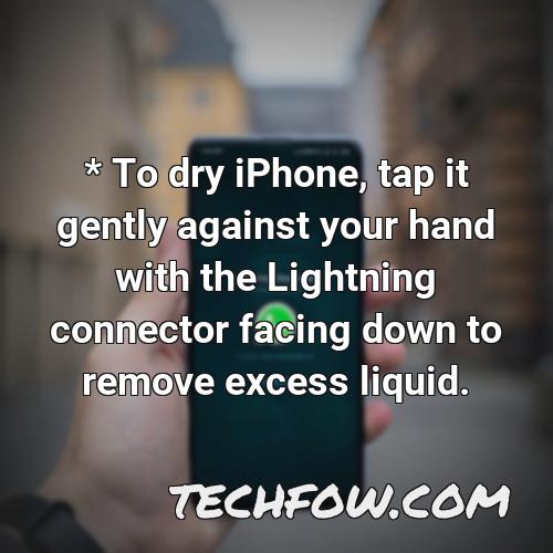 to dry iphone tap it gently against your hand with the lightning connector facing down to remove excess liquid