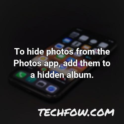 to hide photos from the photos app add them to a hidden album