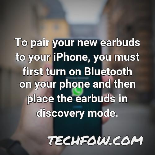 to pair your new earbuds to your iphone you must first turn on bluetooth on your phone and then place the earbuds in discovery mode