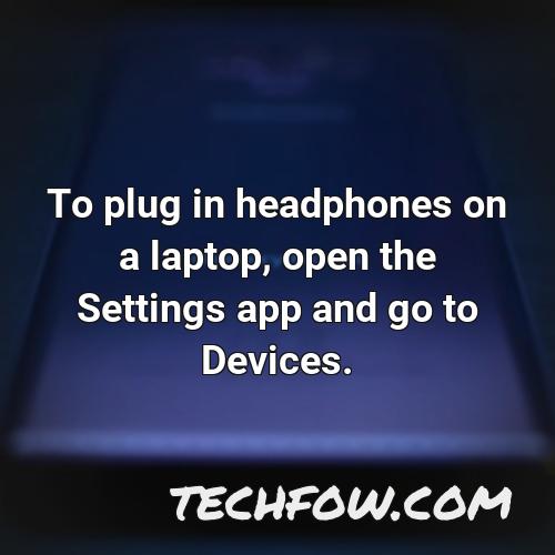to plug in headphones on a laptop open the settings app and go to devices