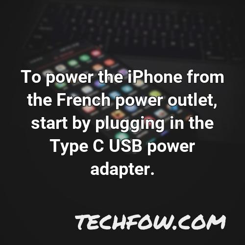to power the iphone from the french power outlet start by plugging in the type c usb power adapter