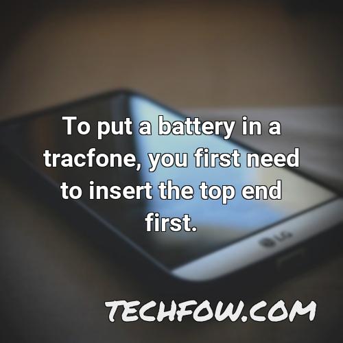 to put a battery in a tracfone you first need to insert the top end first