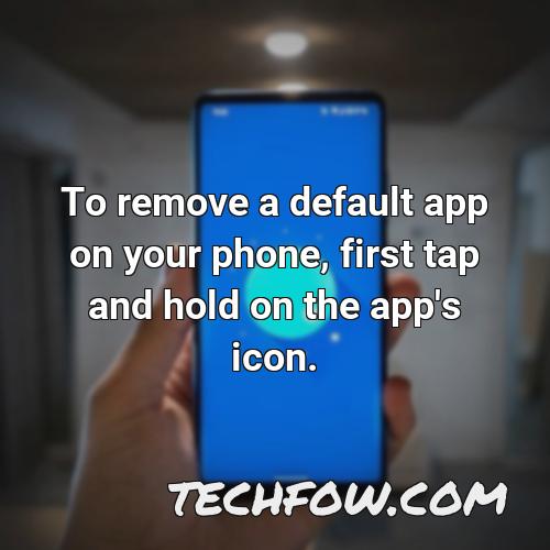 to remove a default app on your phone first tap and hold on the app s icon