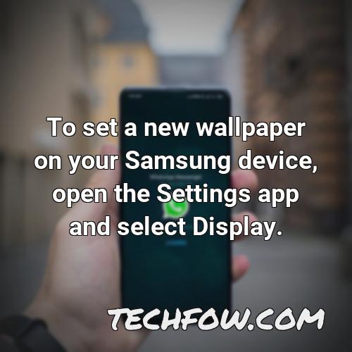 to set a new wallpaper on your samsung device open the settings app and select display