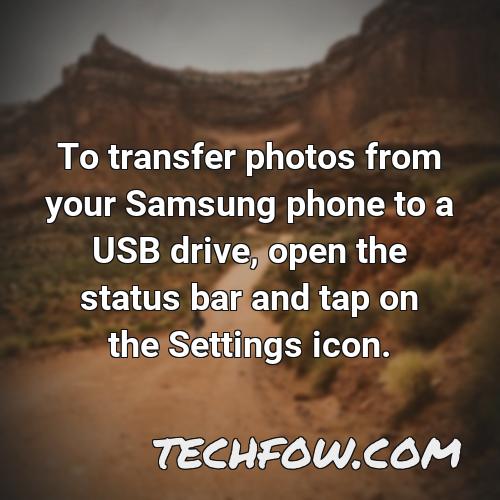 to transfer photos from your samsung phone to a usb drive open the status bar and tap on the settings icon